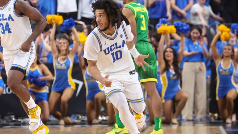 UCLA guard Tyger Campbell (10) reacts after scoring a three-point...
