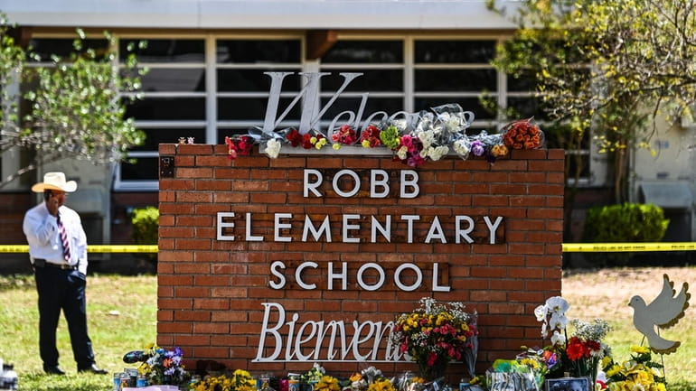 A makeshift memorial in front of Robb Elementary School in...