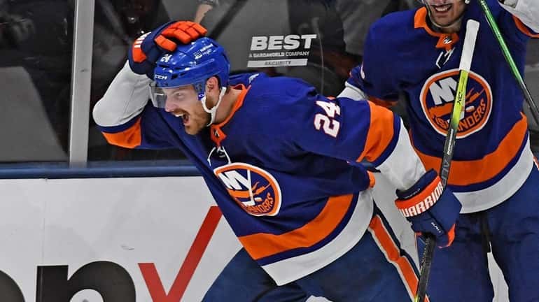 Islanders' Scott Mayfield scores the tying goal in the third...