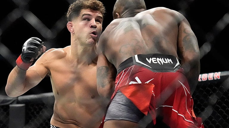 Al Iaquinta sets up a punch against Bobby Green during...