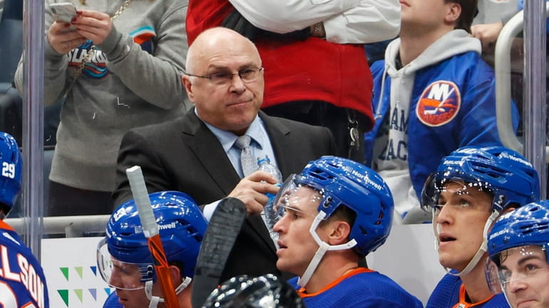 Islanders head coach Barry Trotz looks on in the third...