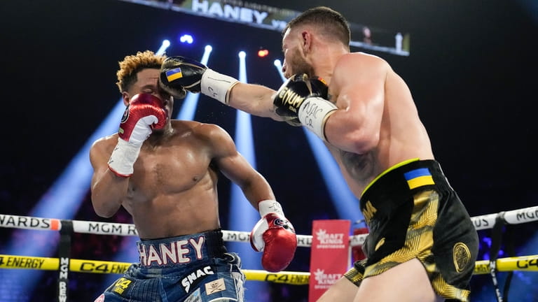 Devin Haney, left, fights Vasiliy Lomachenko in an undisputed lightweight...