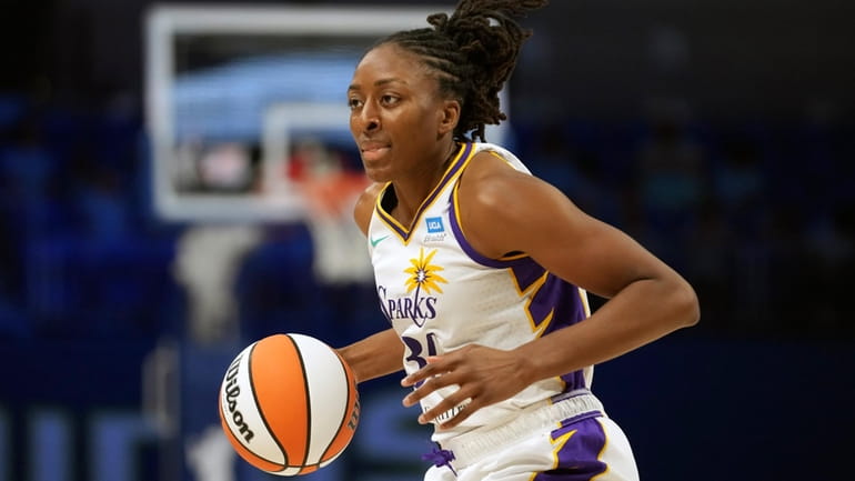 Los Angeles Sparks forward Nneka Ogwumike dribbles the ball during...