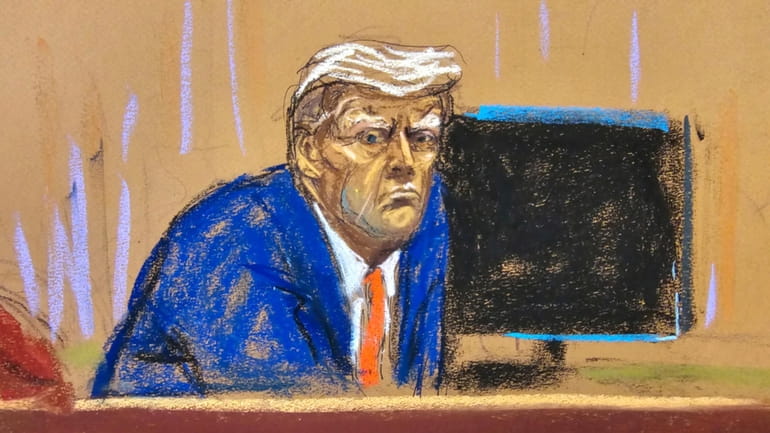 In this courtroom sketch, former President Donald Trump turns to...