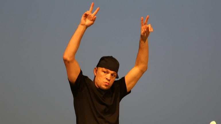 Nate Diaz arrives for a news conference at The Rooftop...