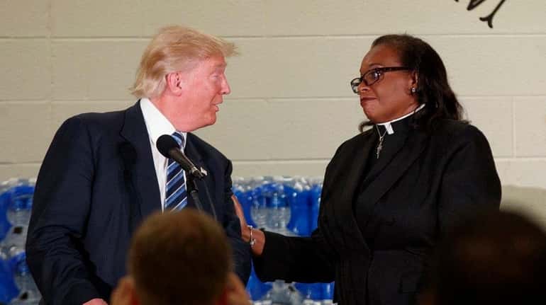 The Rev. Faith Green Timmons interrupts Republican presidential candidate Donald...