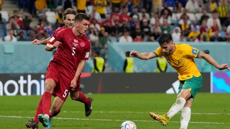 Australia's Mathew Leckie scores his side's first goal during the...