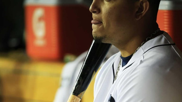 Detroit Tigers third baseman Miguel Cabrera reacts in the dugout...