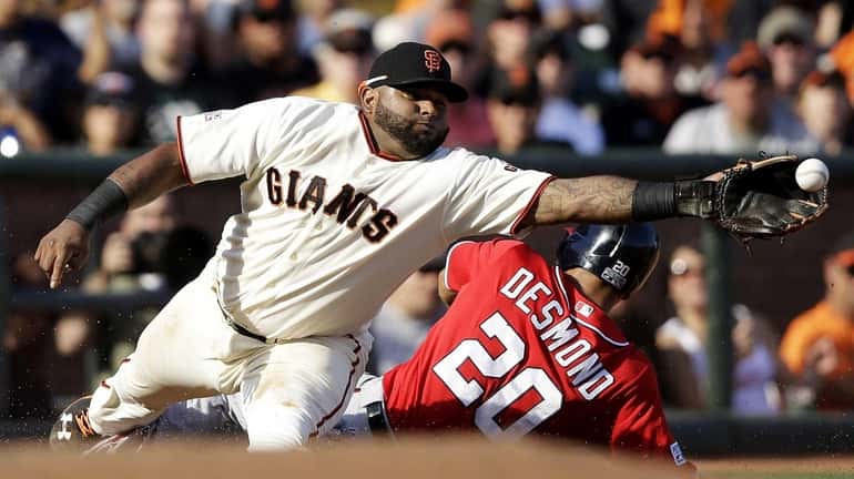 Pablo Sandoval #48 fails to catch a throw by Madison...