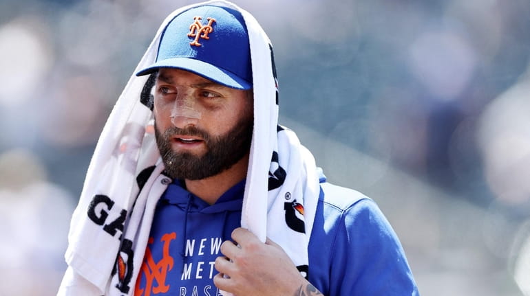 Kevin Pillar #11 of the Mets walks off the field...