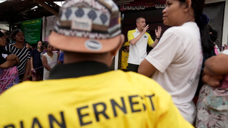 Rian Ernest, a Golkar Party candidate, speaks during a campaign...