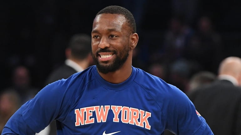 New York Knicks guard Kemba Walker warms up before a game...