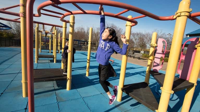 Reina Konno, 7, of Plainview at the playground at Cedar...