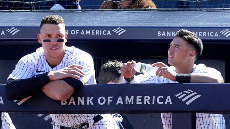 Aaron Judge and Anthony Volpe of the Yankees look on from the...