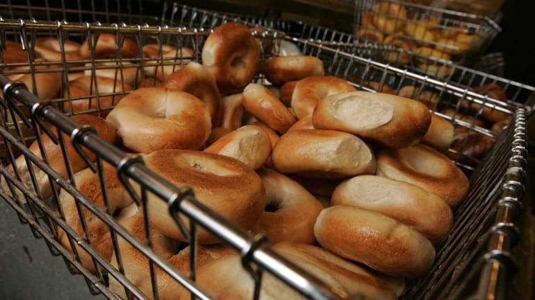 Bagels await their schmear at the Bagel Boss store in...