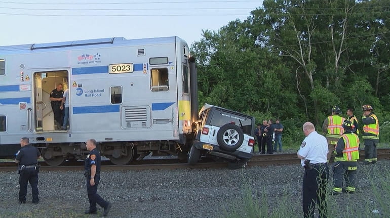 An LIRR train hit a motor vehicle on the tracks east...