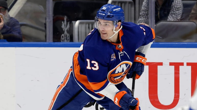 Mathew Barzal #13 of the New York Islanders skates against...