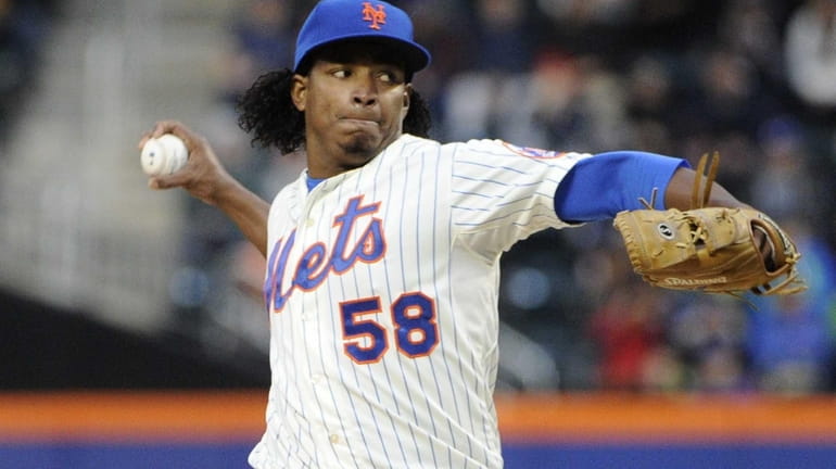Mets starter Jenrry Mejia throws against the Miami Marlins in...
