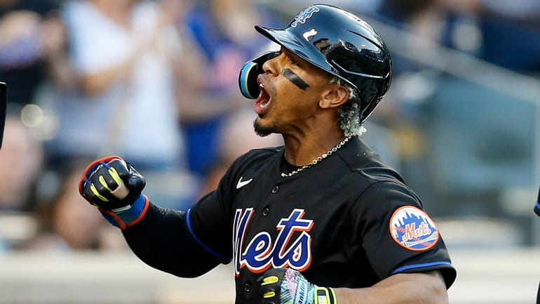 Francisco Lindor #12 of the Mets celebrates his first inning three...