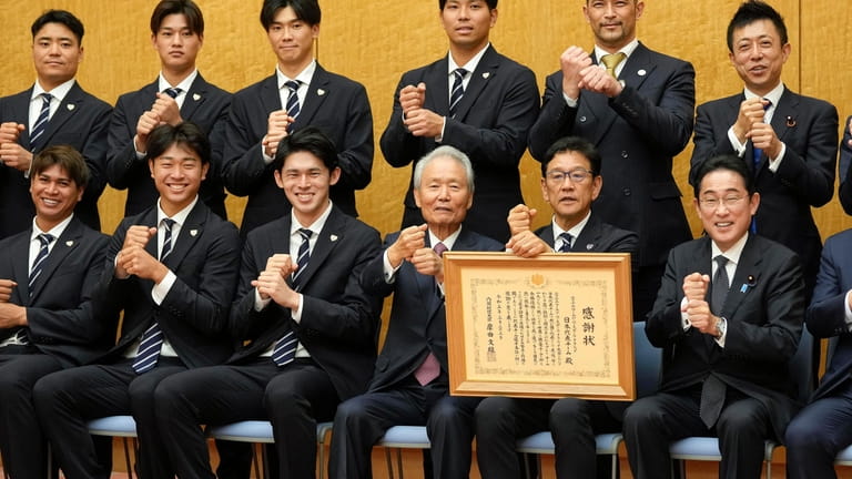 Japan's World Baseball Classic (WBC) team manager Hideki Kuriyama, second...