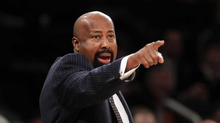 Mike Woodson calls out to his team in the second...