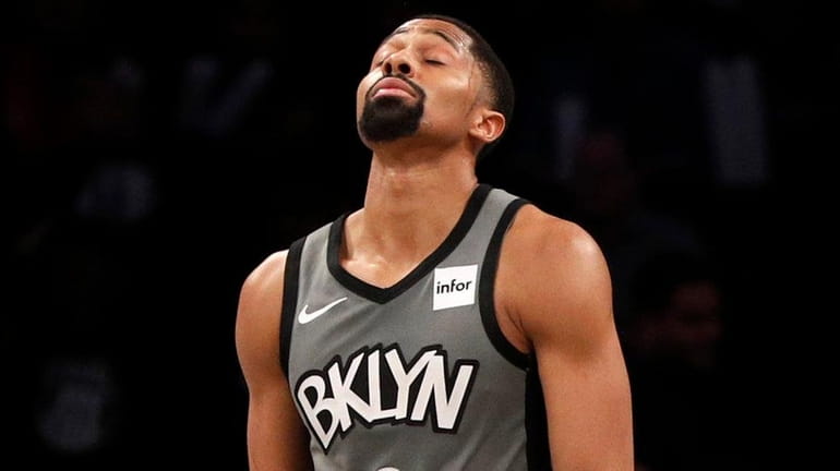 Spencer Dinwiddie and Garrett Temple of the Nets reacts late during the...