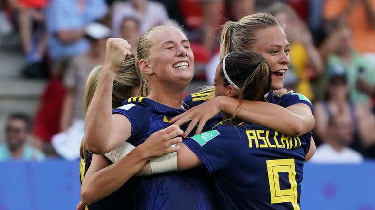 Stina Blackstenius of Sweden celebrates with teammate after scoring a...