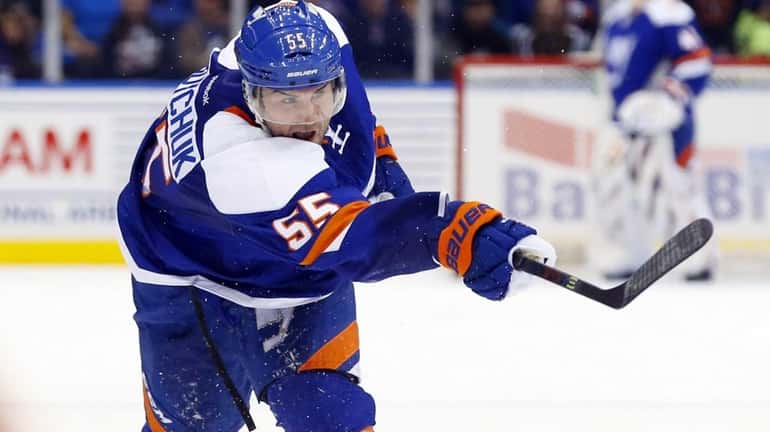 Johnny Boychuk #55 of the New York Islanders shoots the...