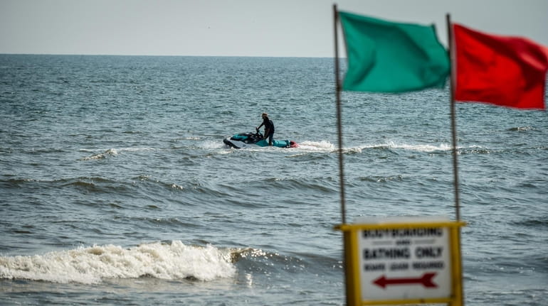 Town of Hempstead lifeguard patrolling the waters for sharks at...
