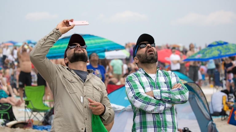 Spectators look on as John Klatt Airshows/Jack Links' Screamin Sasquatch...