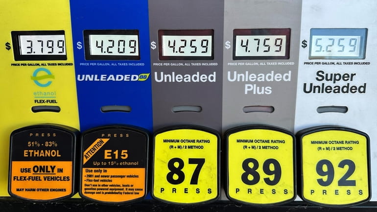 Gas prices are seen at a gas station in Riverwoods,...