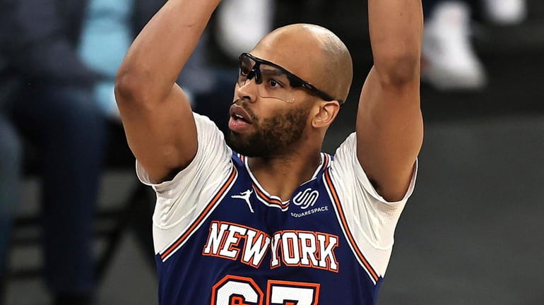 The Knicks' Taj Gibson shoots for two points against the Suns...