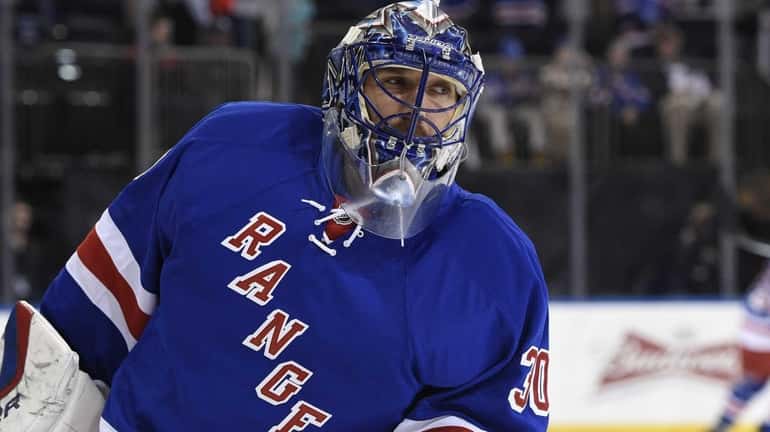 New York Rangers goalie Henrik Lundqvist warms up on the...