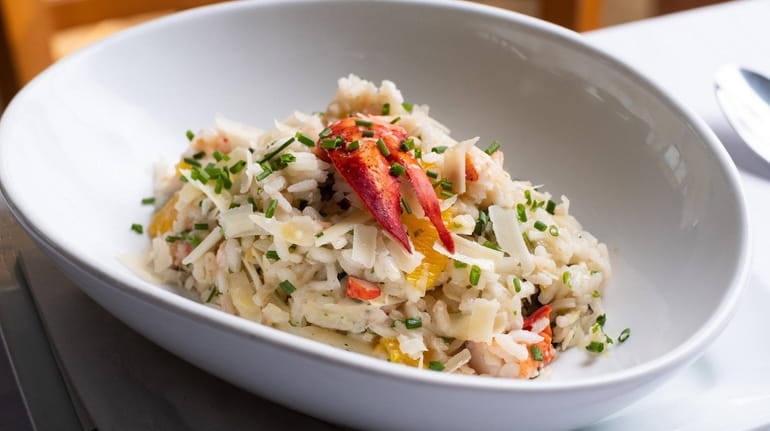Lobster risotto with basil, chives, parmesan and orange served at...