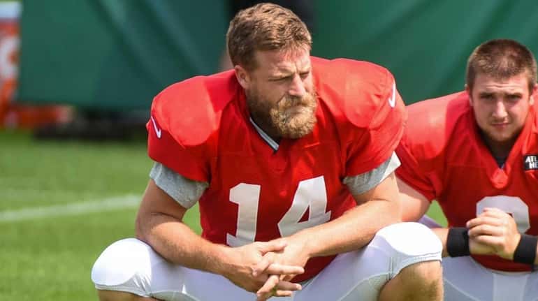 New York Jets quarterback Ryan Fitzpatrick stretches during practice at...
