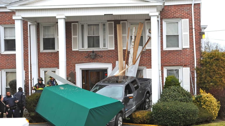 A pickup truck driver crashed into a funeral home in...