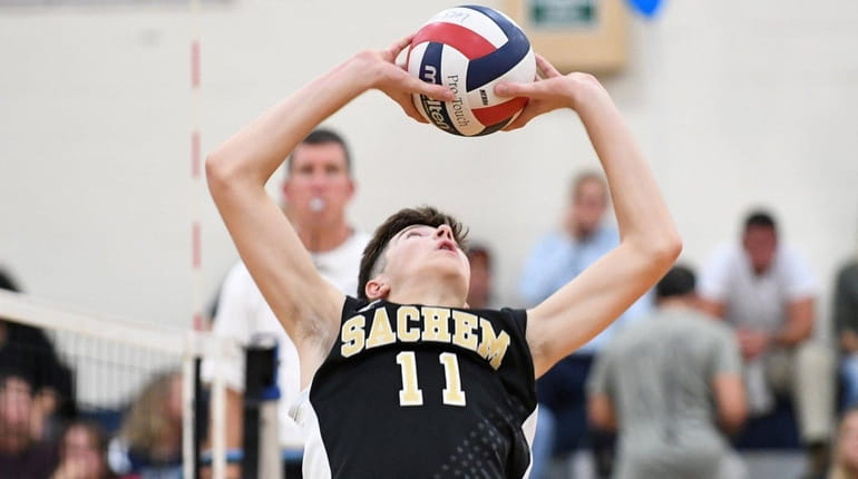 Sachem North's Jack Driscoll (11) sets the ball during the...