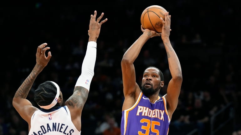 Phoenix Suns forward Kevin Durant (35) shoots over Minnesota Timberwolves...