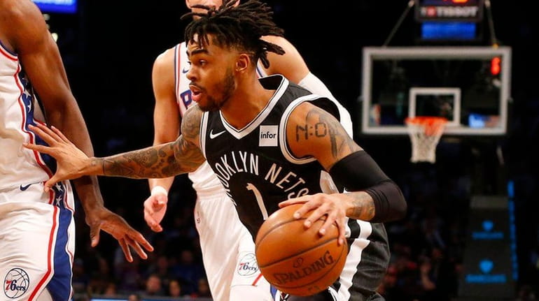 D'Angelo Russell of the Nets drives to the hoop in...