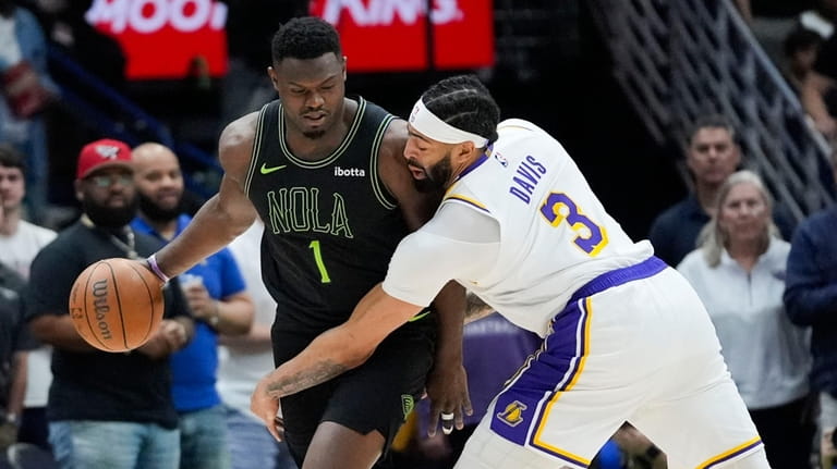 New Orleans Pelicans forward Zion Williamson (1) works the ball...