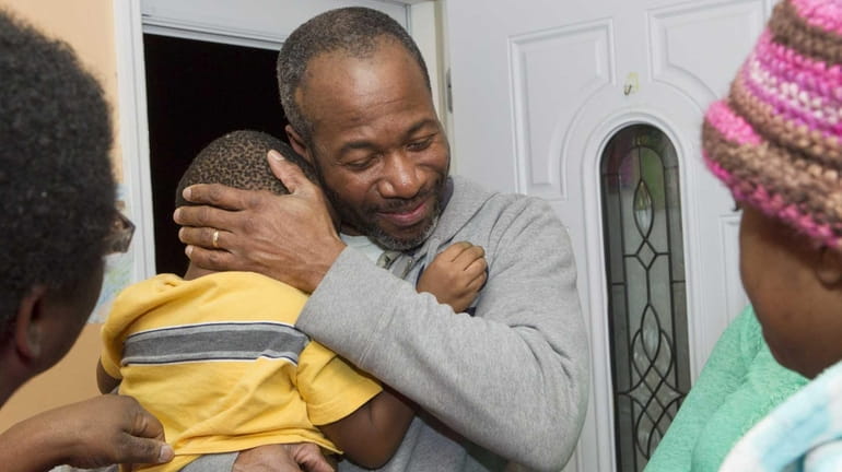 Pernell Mitchell gets a welcome home hug from his son...