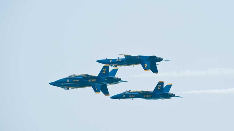 The U.S. Navy's Blue Angels soar across the sky at...