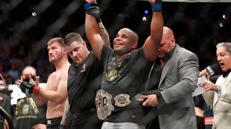 Daniel Cormier celebrates after defeating Stipe Miocic in a heavyweight...