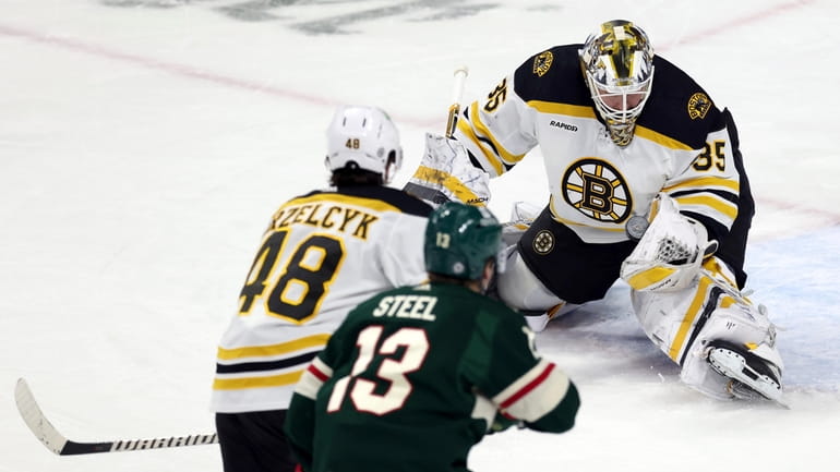 Boston Bruins goaltender Linus Ullmark (35) catches the puck during...