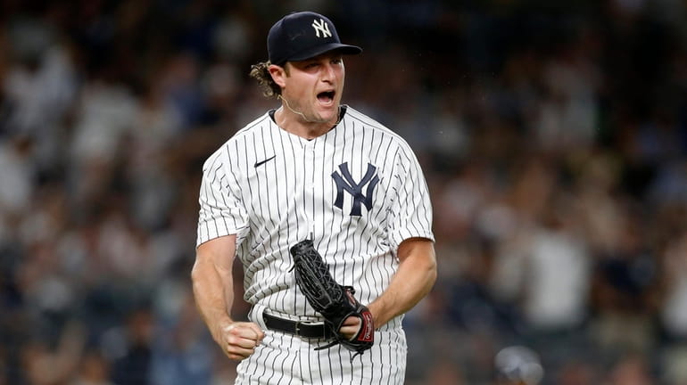 Gerrit Cole #45 of the Yankees reacts after getting a sixth...