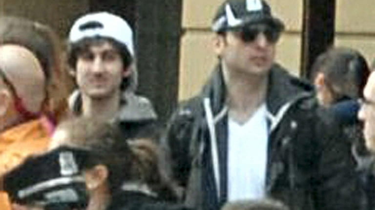 Brothers, from left, Dzhokhar and Tamerlan Tsarnaev in the crowd...