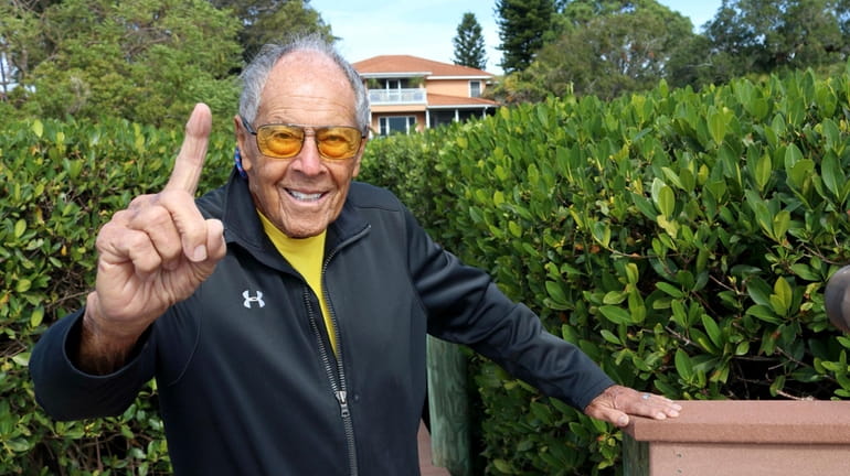 FILE - Tennis coach Nick Bollettieri gestures outside his home...
