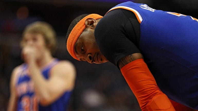 Carmelo Anthony #7 of the New York Knicks looks on...