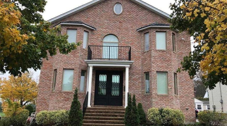 Priced at $1,368,000 and located on Brown Street in Mineola,...