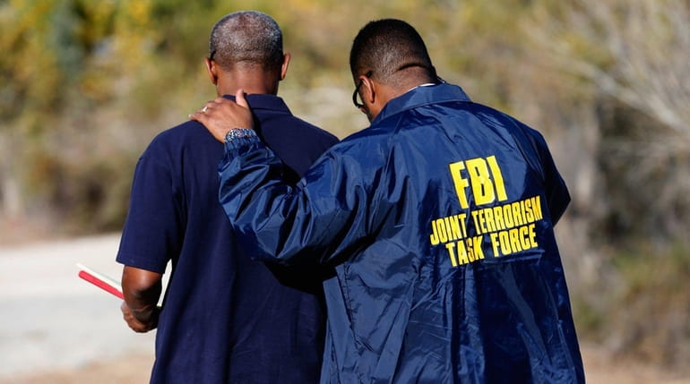 A member of the FBI Joint Terrorism Task Force during...